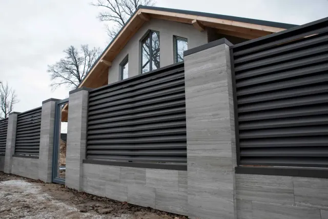Newly built concrete and metal fence