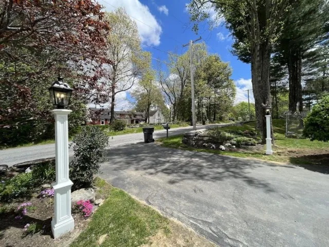 dual light posts installed at the end of a driveway offering an impressive and welcoming entrance to the driveway