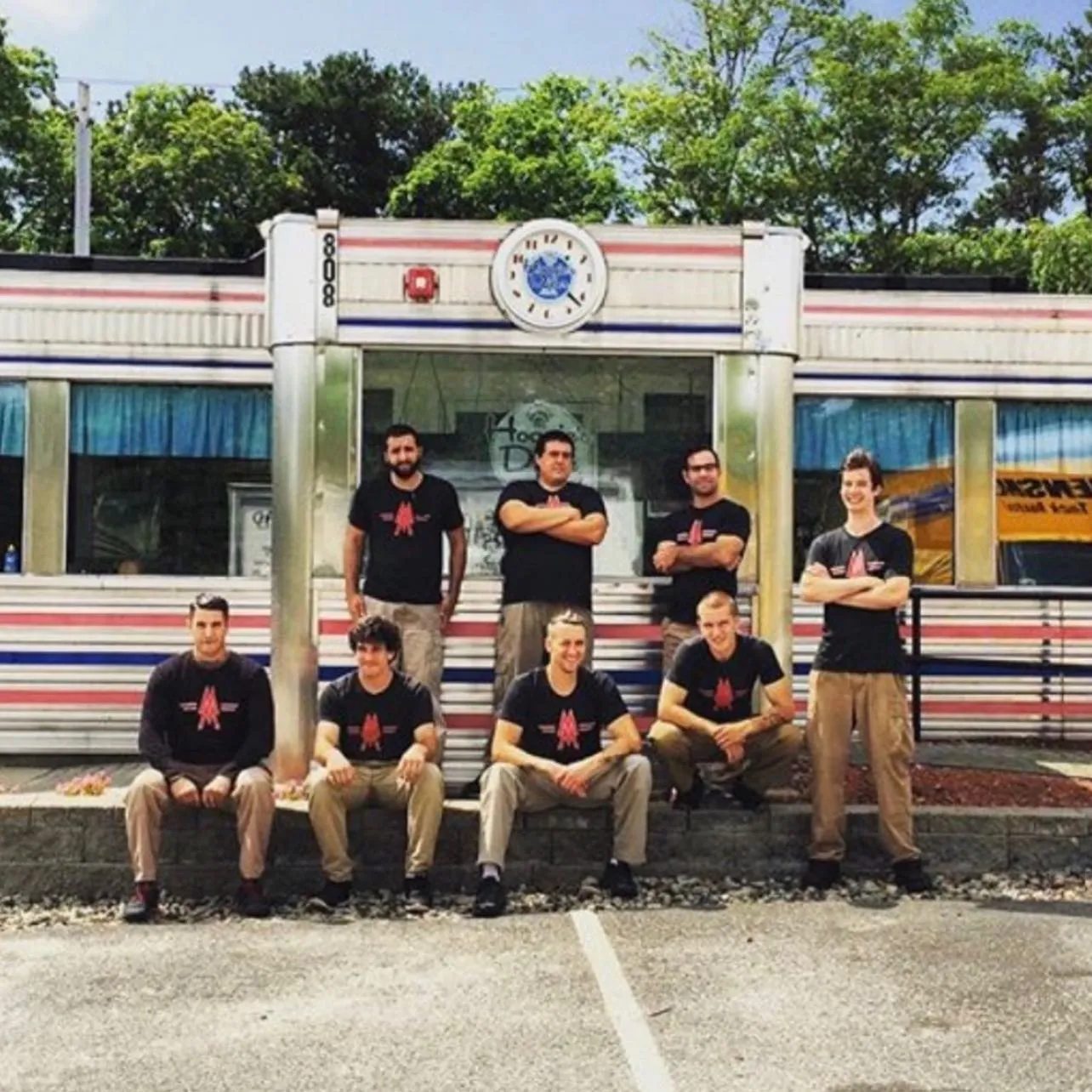 Crew in branded shirts