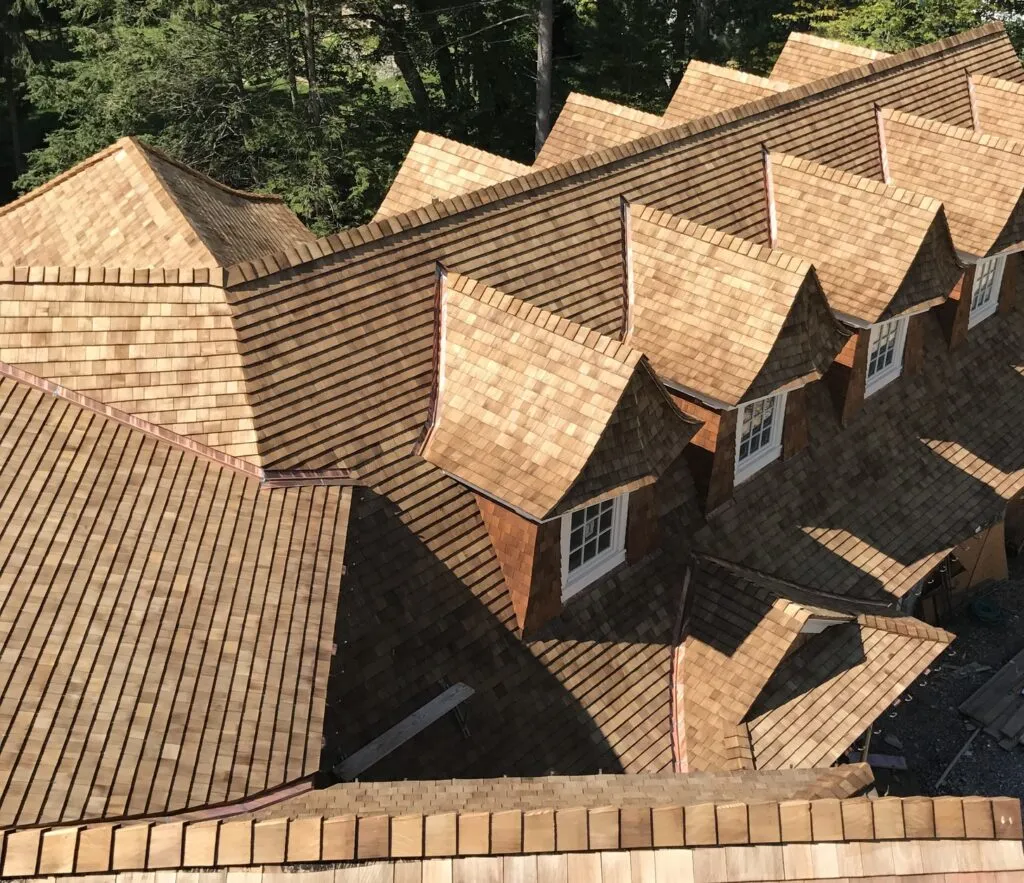 Cedar shake roof aerial multi dormer greater boston ma installed by paul john and son roofing.
