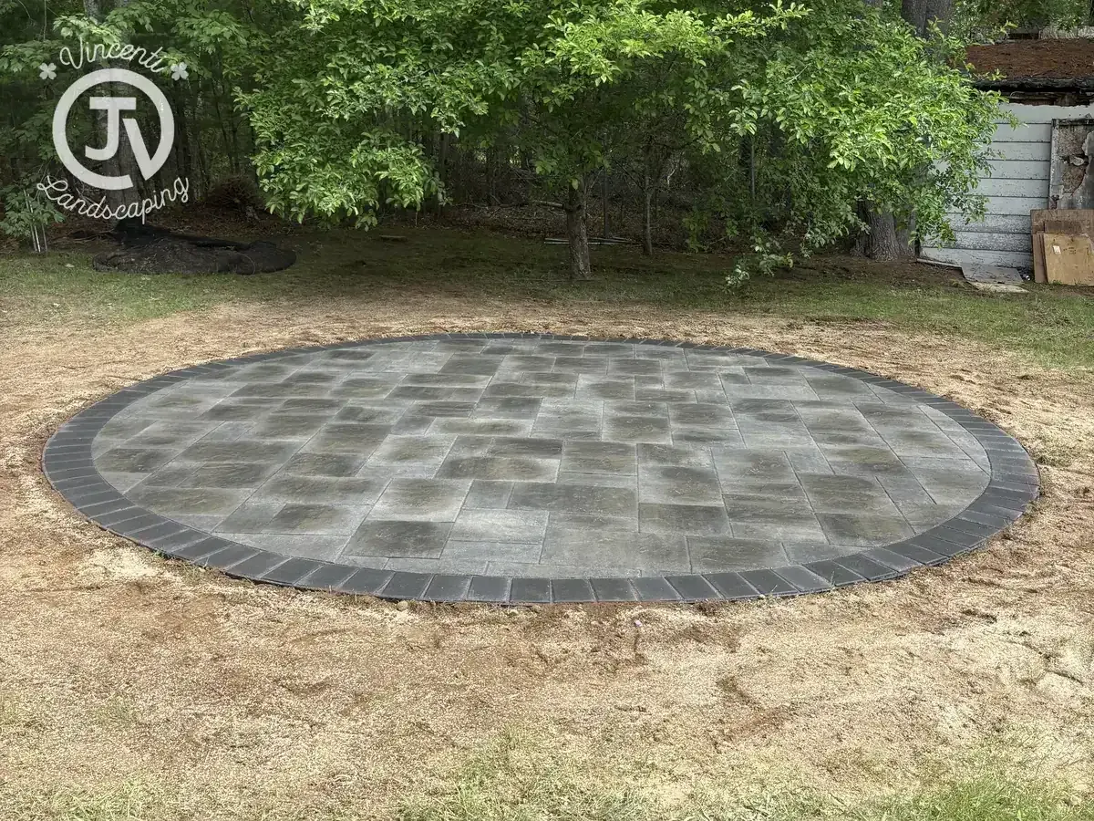 Circular paver pad installation by Vincenti Landscaping