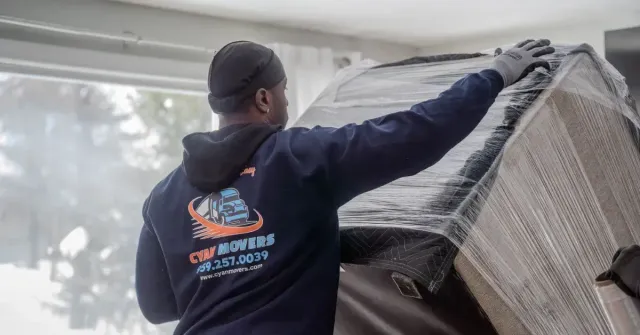 Cyan Movers professional mover securing large furniture during a residential relocation in Connecticut