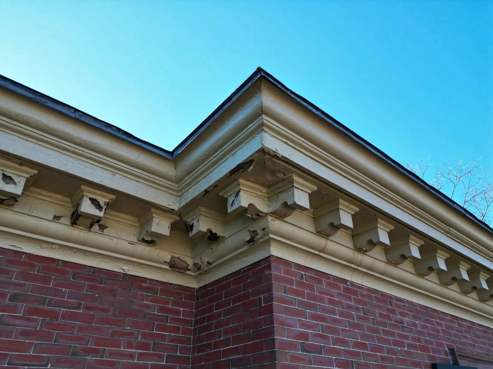 Soffit with water damage investigation