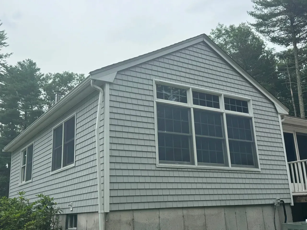 Completed siding installation on a residential elevation