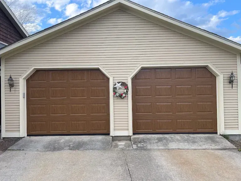 Two brown wood-tone doors with a center entry door