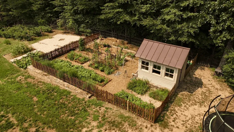 Fenced kitchen garden and potting shed from above