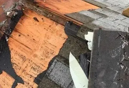 Roofer performing roof repair on a Connecticut home