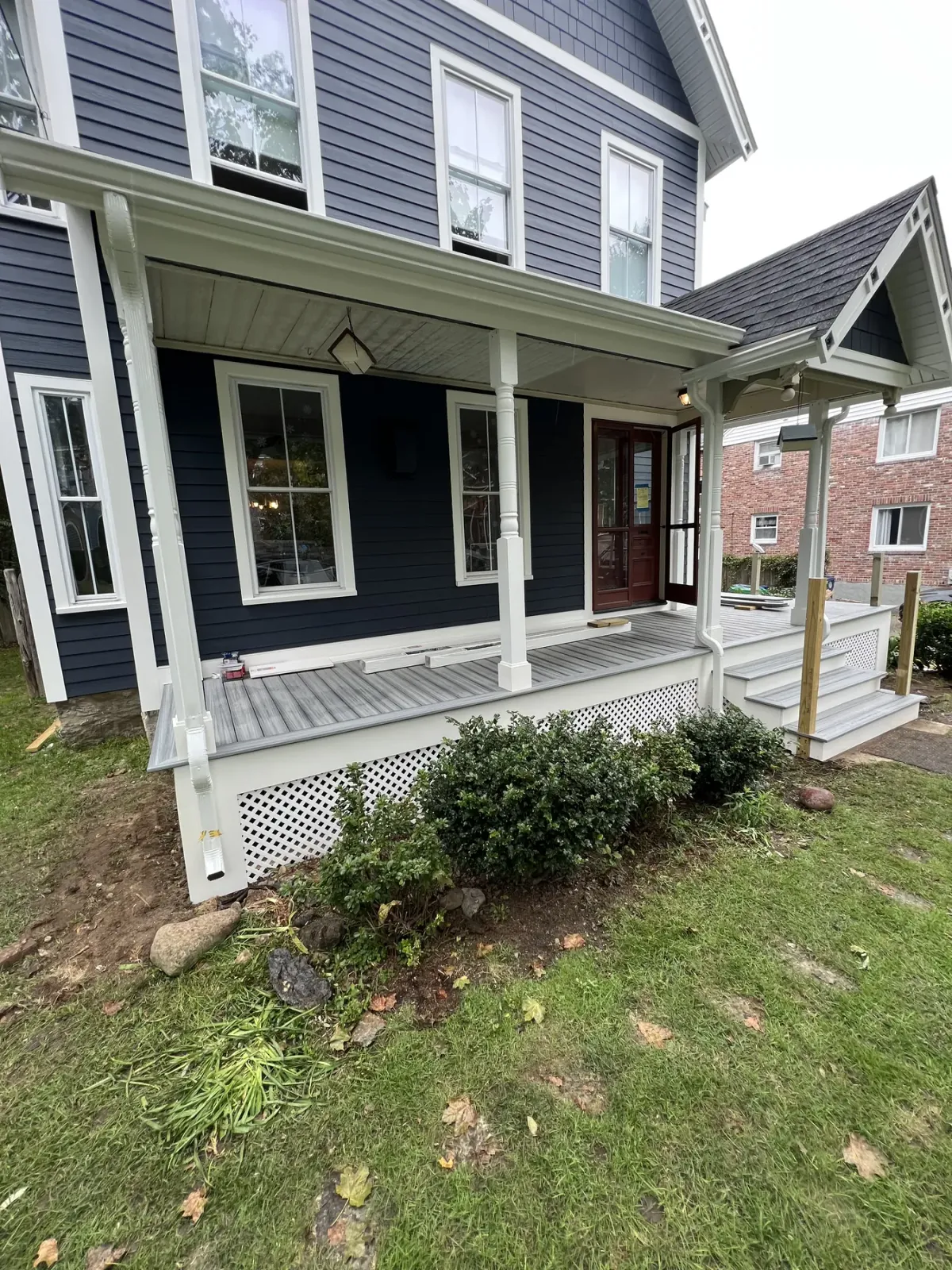 Finished farmer's porch with new railings and trim