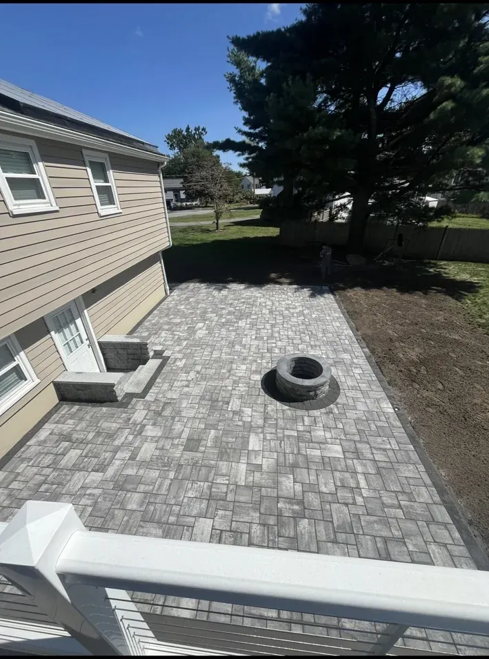 Backyard paver patio with fire pit