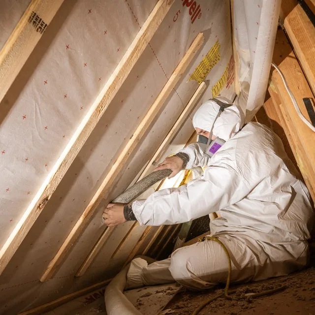 Horizon Homes crew installing insulation in a Maine home