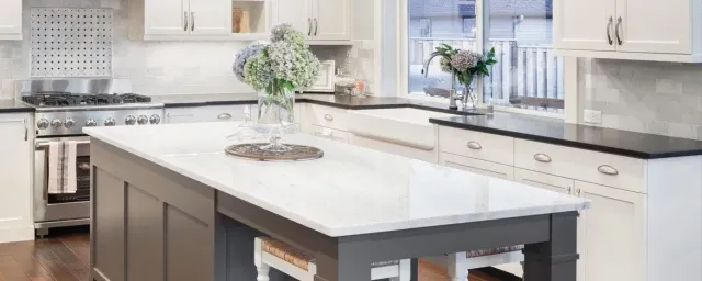 A kitchen with a large island in the middle of it