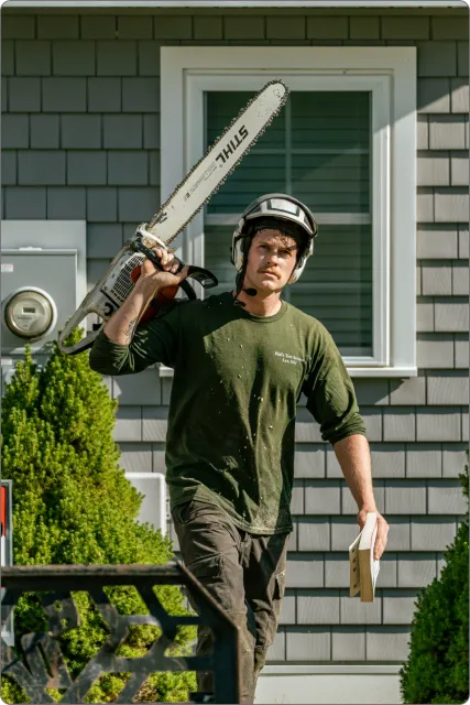 Man holding chainsaw