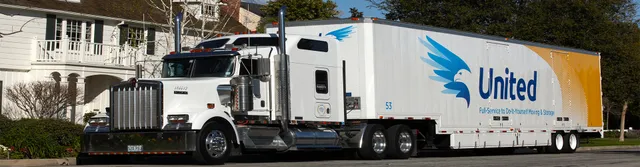 Freight Moving Truck in front of house