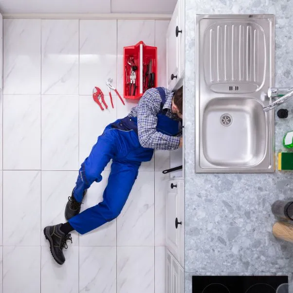aerial view of a plumber at work gray me