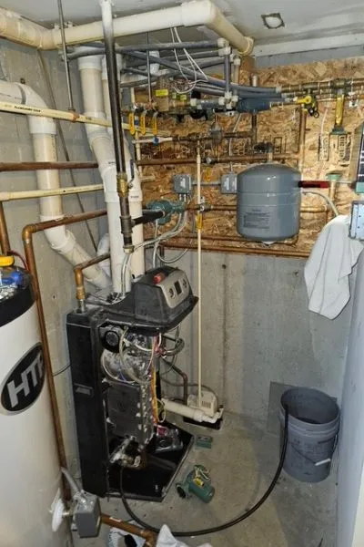 Basement boiler and water heater with pipes