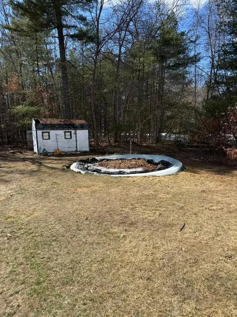Same yard after the pool was removed, ring cleared