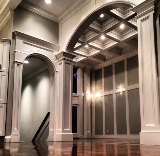 Soaring ceilings. Layered millwork. A statement arch that anchors it all.

What makes this space special isn’t just the scale — it’s the balance. The coffered ceiling adds depth without feeling heavy, the paneled walls create rhythm and proportion, and the full-height arch softens the geometry with just the right amount of contrast.

It’s the kind of craftsmanship you feel before you notice — precise profiles, clean transitions, and shadow lines that align perfectly from floor to ceiling.

Refined. Elevated. Timeless. 

#echelonbuilders #architecture #custommillwork #luxuryhomes #finecarpentry