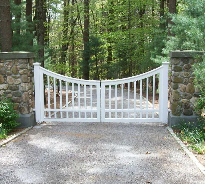 Decorative swing gate restricting access to a residential property