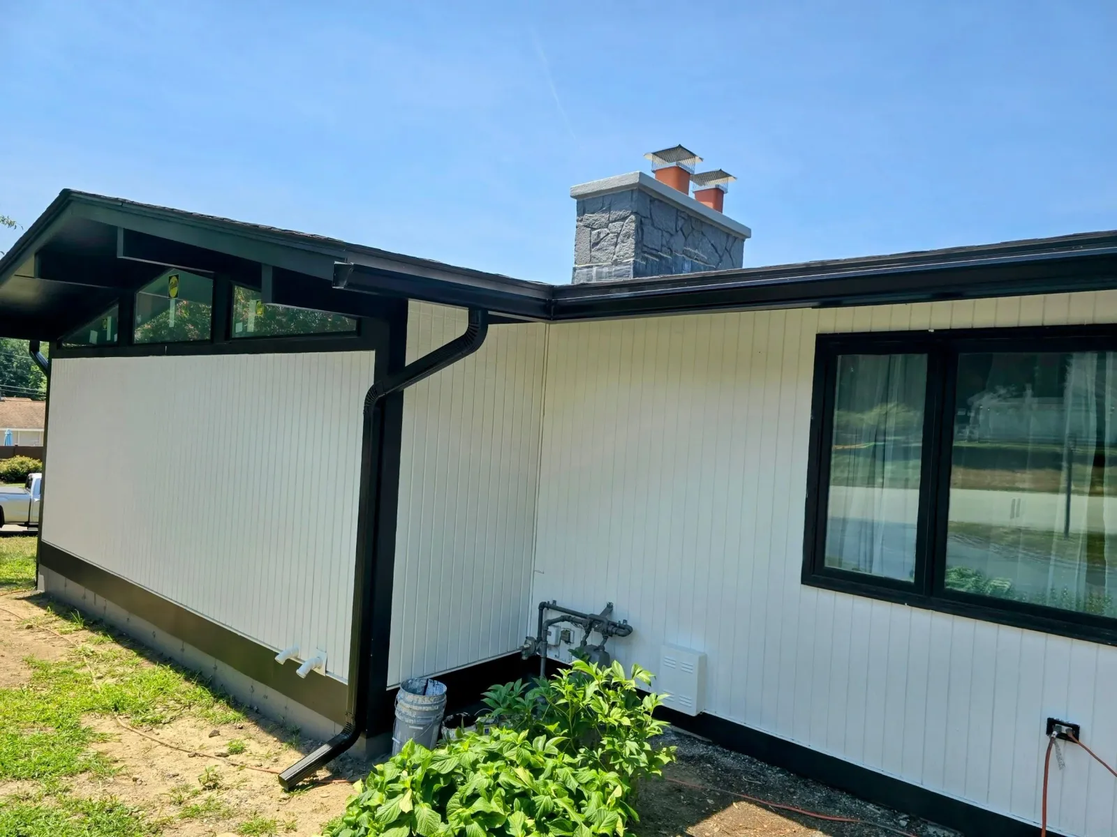 Sleek Black Seamless Gutter Installation in Leominster, MA