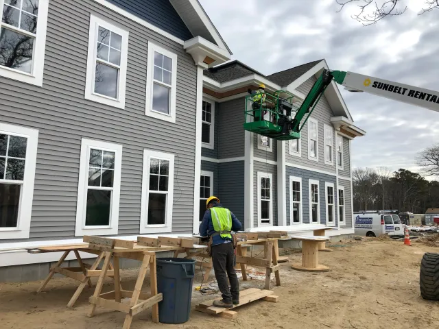 New siding and windows installed on a multi-housing unit on Cape Cod, by Fernandes Construction.