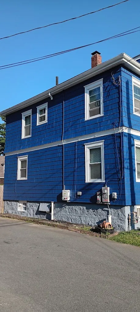 Dark blue residential exterior painting completed in New Bedford - NG Painting Pro quality work