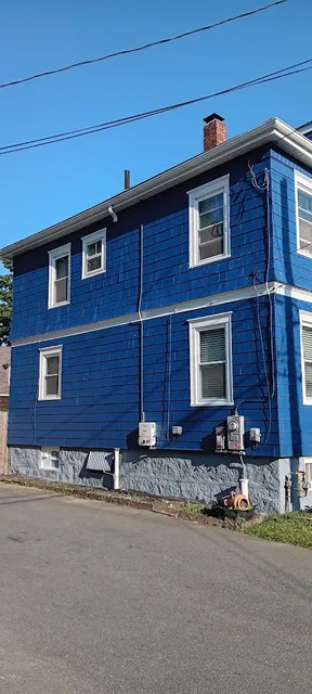 Dark blue residential exterior painting completed in New Bedford - NG Painting Pro quality work