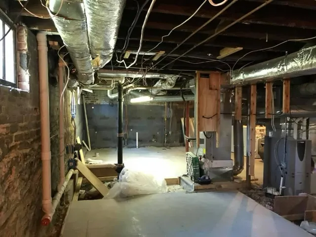Basement stair and floor renovation in progress