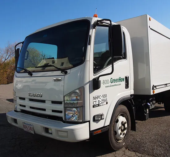 GreenHow large white work truck used for lawn care and pest control