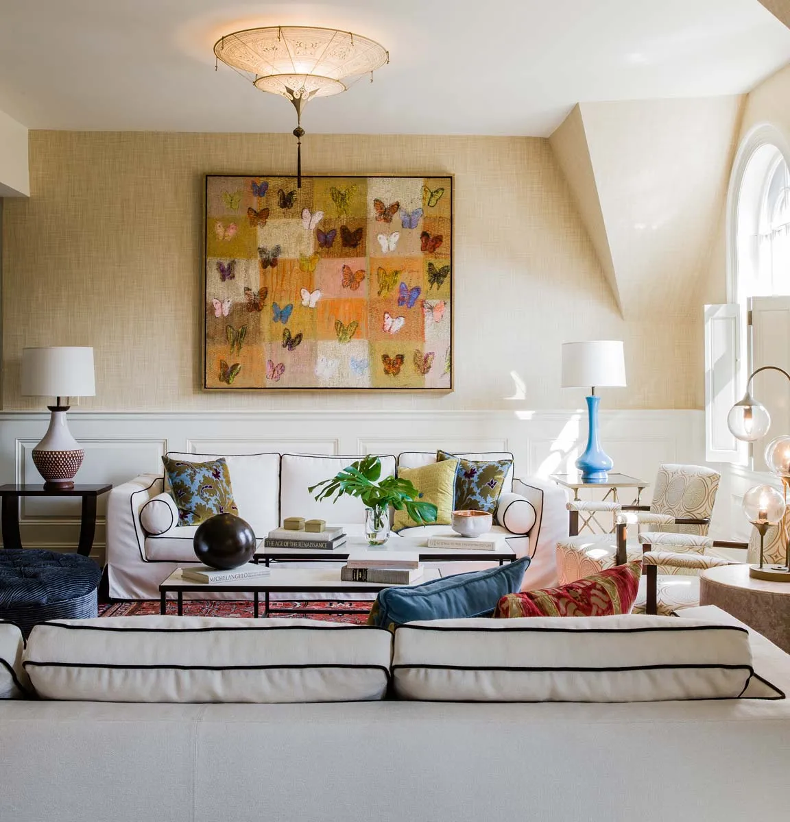 A living room filled with furniture and a painting