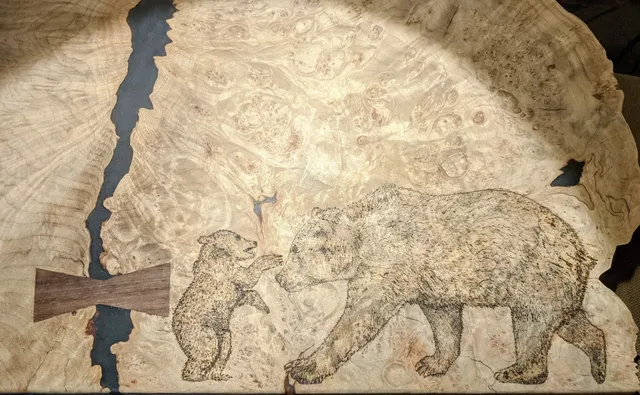 Woodburned bears on burl slab