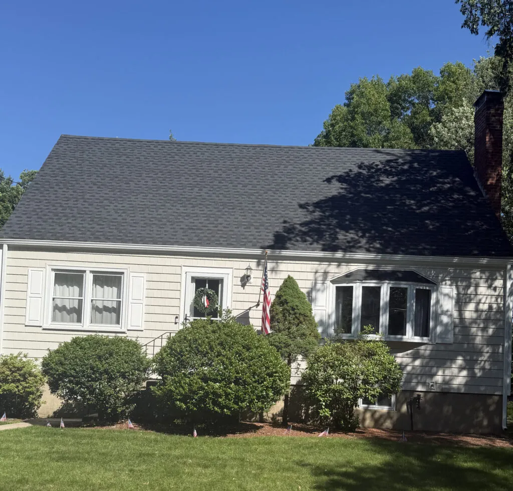 yellow ranch style house with newly installed exterior siding
