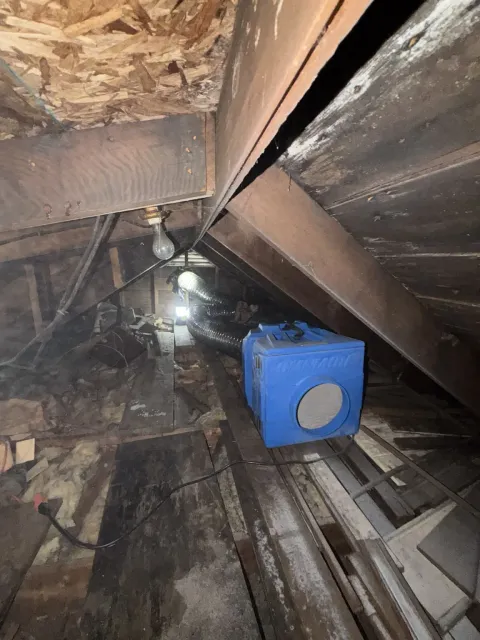 Air-management equipment and ducting positioned inside the attic remediation work area during Smithfield Rhode Island mold remediation project