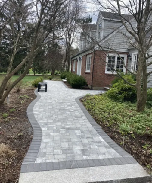 Belgard granite paver walkway with charcoal border. Westwood, MA.