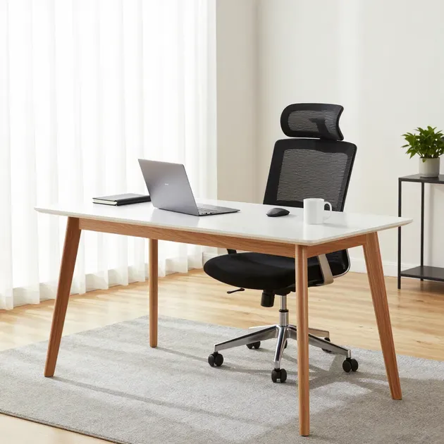 Modern home office with wooden desk, laptop, mesh chair, and bright window curtains