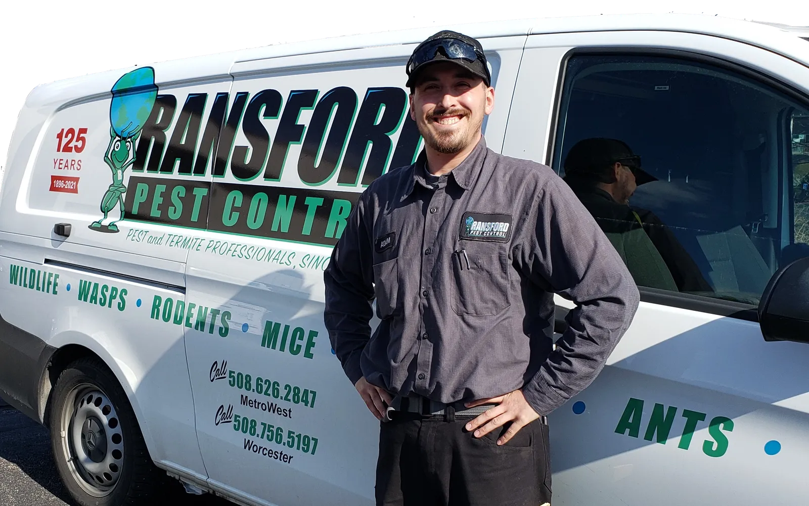 Ransford employee in front of Ransford-branded Van