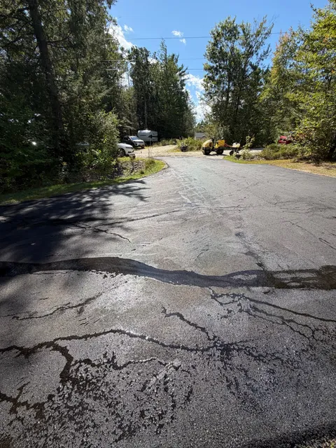 Driveway crack sealing and patching with roller on site