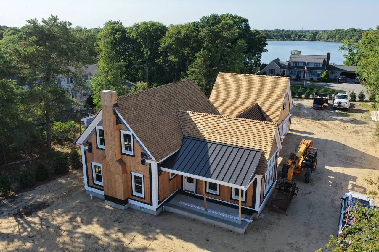 West Dennis home with new red cedar roof and standing seam metal porch roof