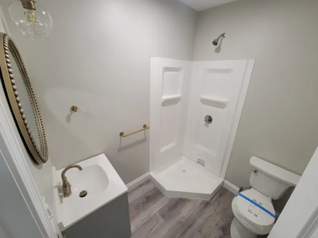 Finished bathroom remodel by XStream Plumbing & Heating in Woburn, MA
