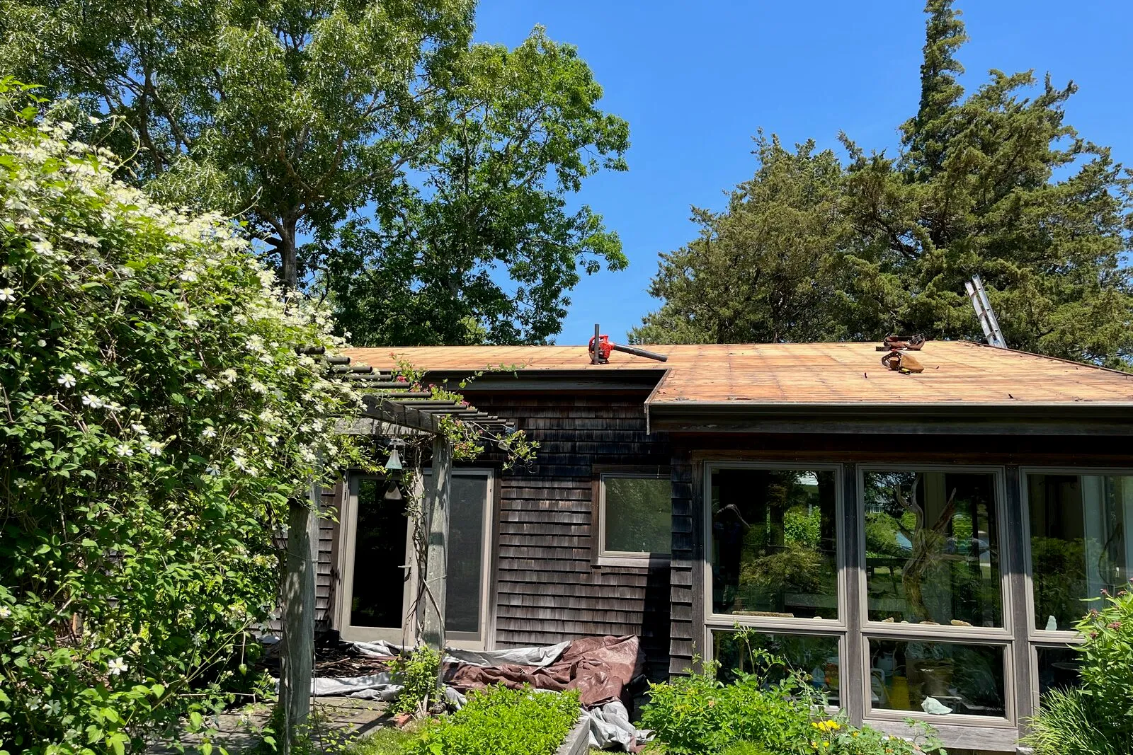 Coastal Cape Cod roof installation in Falmouth with marine-grade flashings.