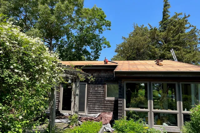 Coastal Cape Cod roof installation in Falmouth with marine-grade flashings.