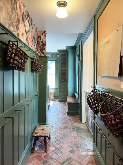 Elegant green hallway with storage baskets
