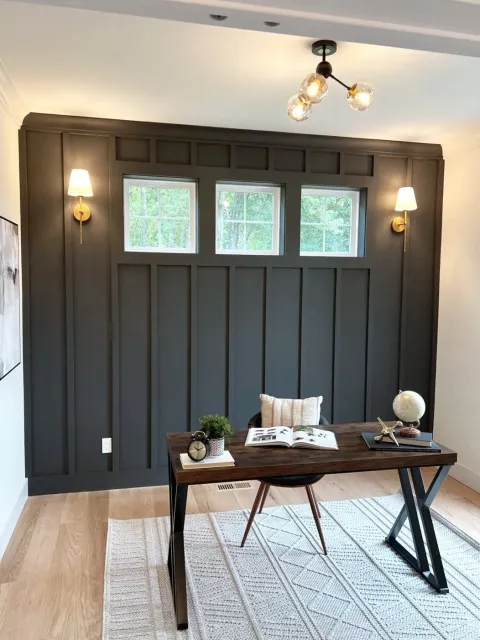 A beautiful office with subtle but perfect lighting choices on the wall and on the ceiling