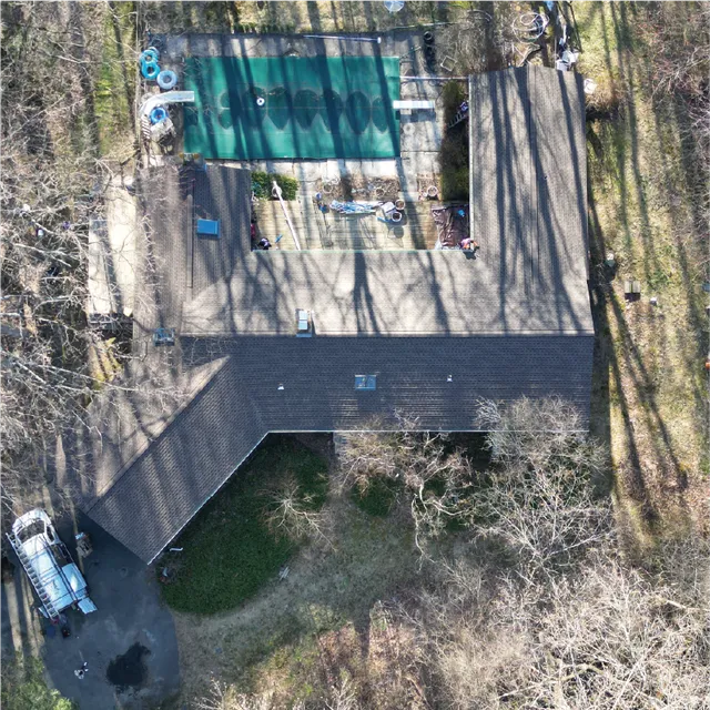 Aerial view of completed asphalt shingle roof on Connecticut home