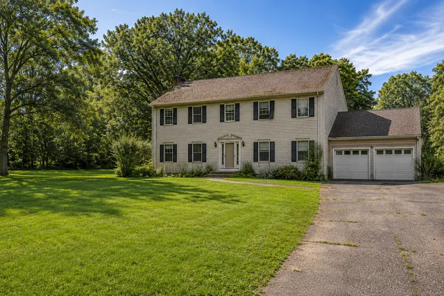 Before: original beige vinyl-sided Connecticut colonial home prior to Stringa Construction full house renovation