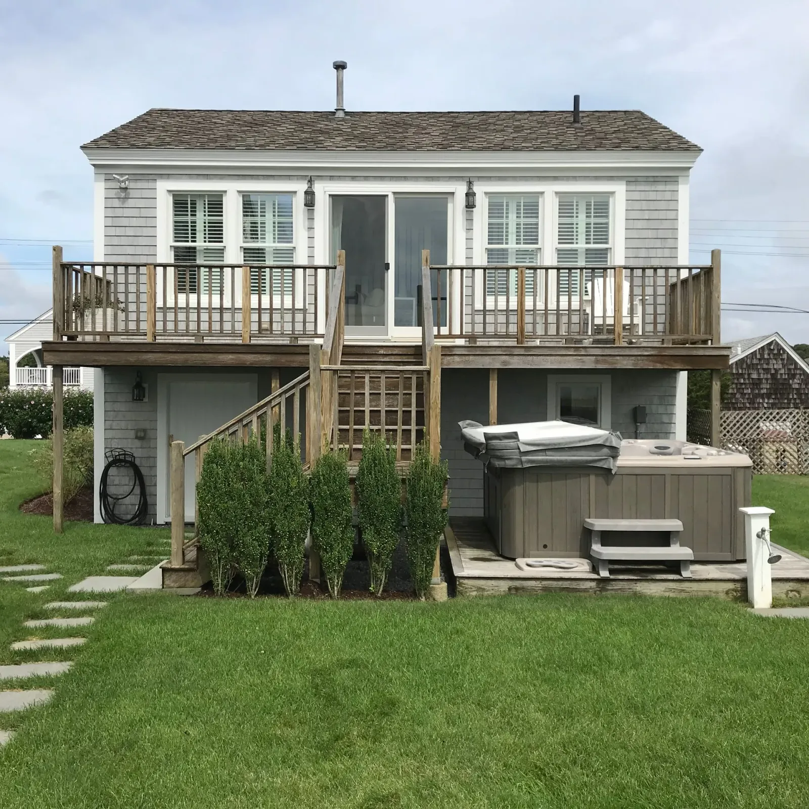 A house with a hot tub in front of it