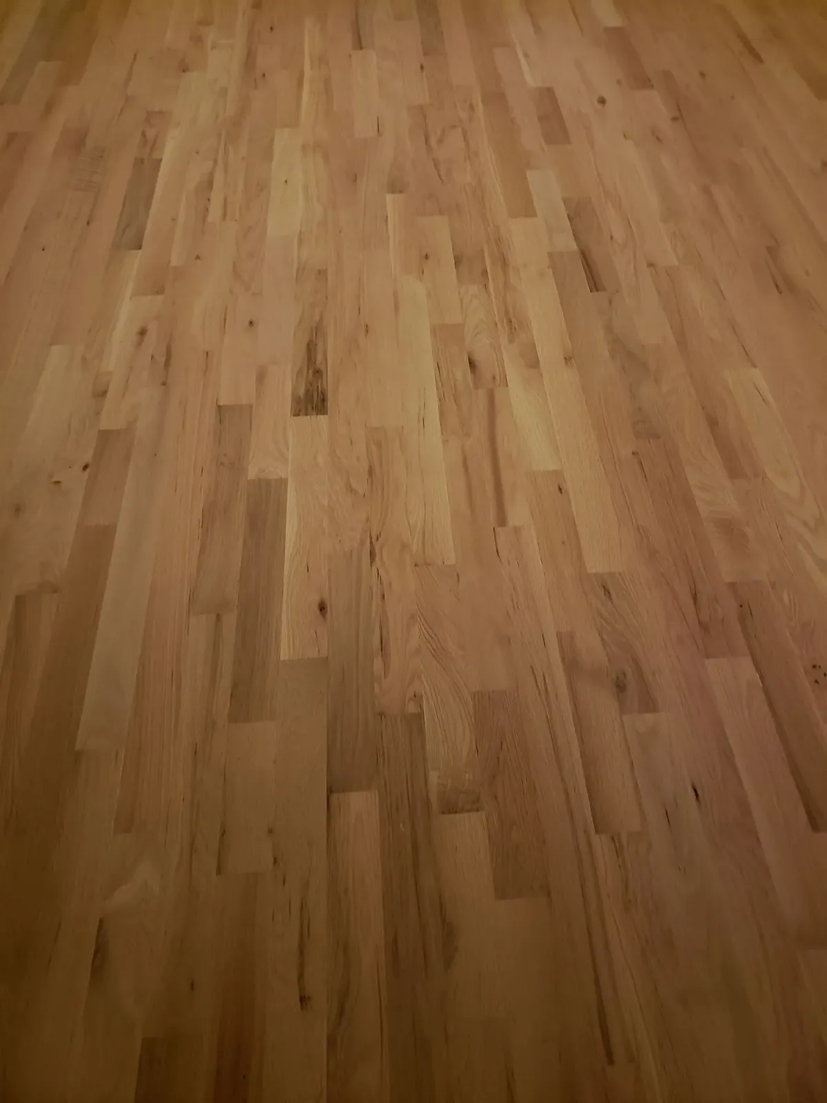 A close up of a wooden floor in a room