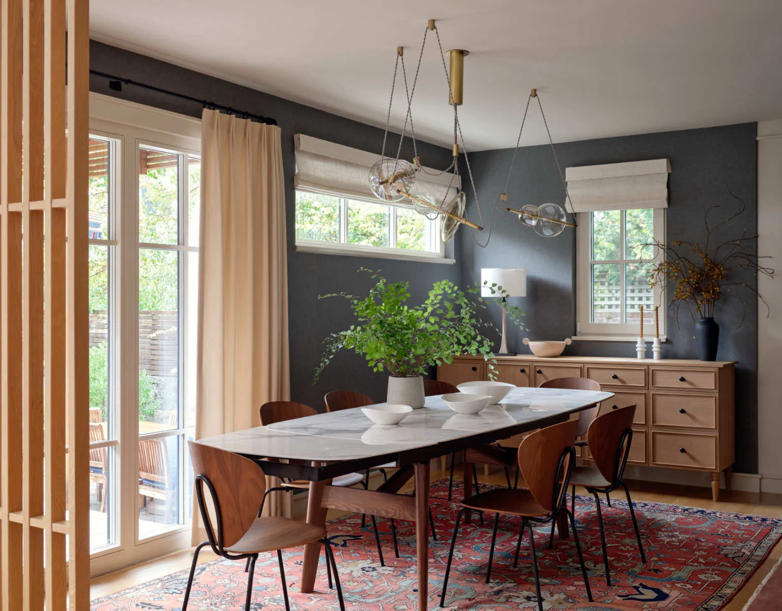 A dining room with a table and chairs
