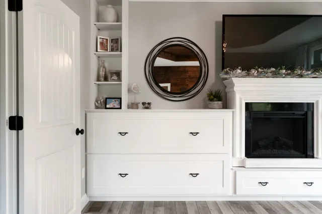 Custom Built-In drawers and a fireplace mantel; we built for clients of ours in their bedroom
