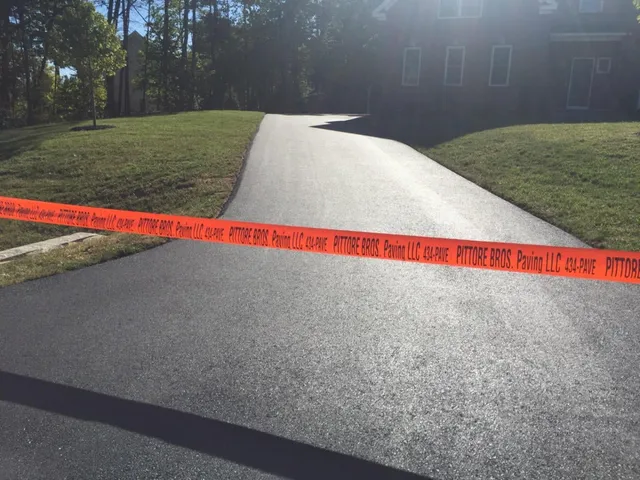 Freshly paved residential asphalt driveway in Southern New Hampshire