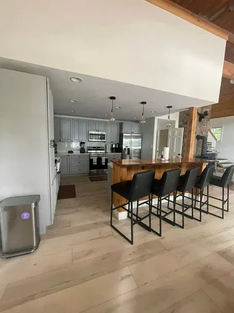 Gleaming open-concept kitchen and dining area — recurring maid service Sebago Lake ME